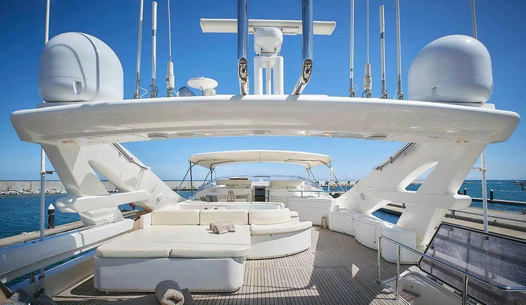 Flybridge jacuzzi and sunpad seating area on board Camarik