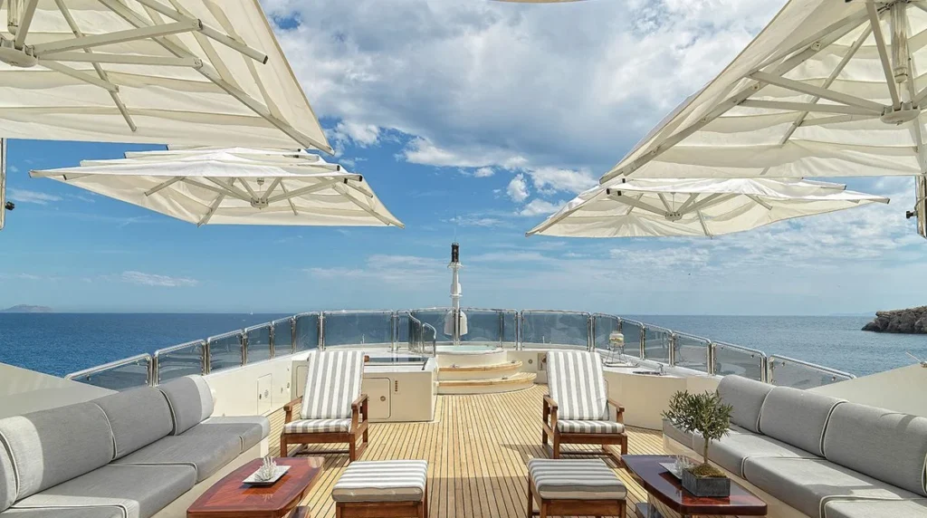 Sun deck jacuzzi and lounge seating aboard charter yacht Alexandra