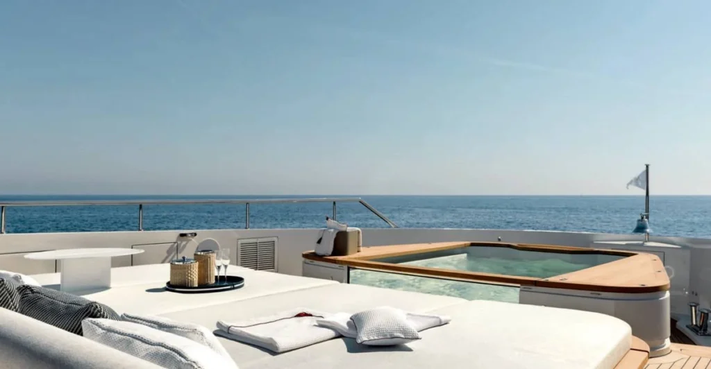 Sundeck jacuzzi and lounge seating aboard Alluria