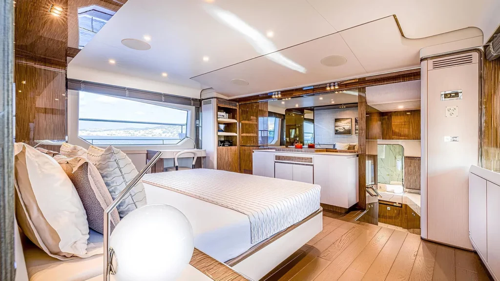 Master cabin aboard Anastasia V with bow-facing bed and window
