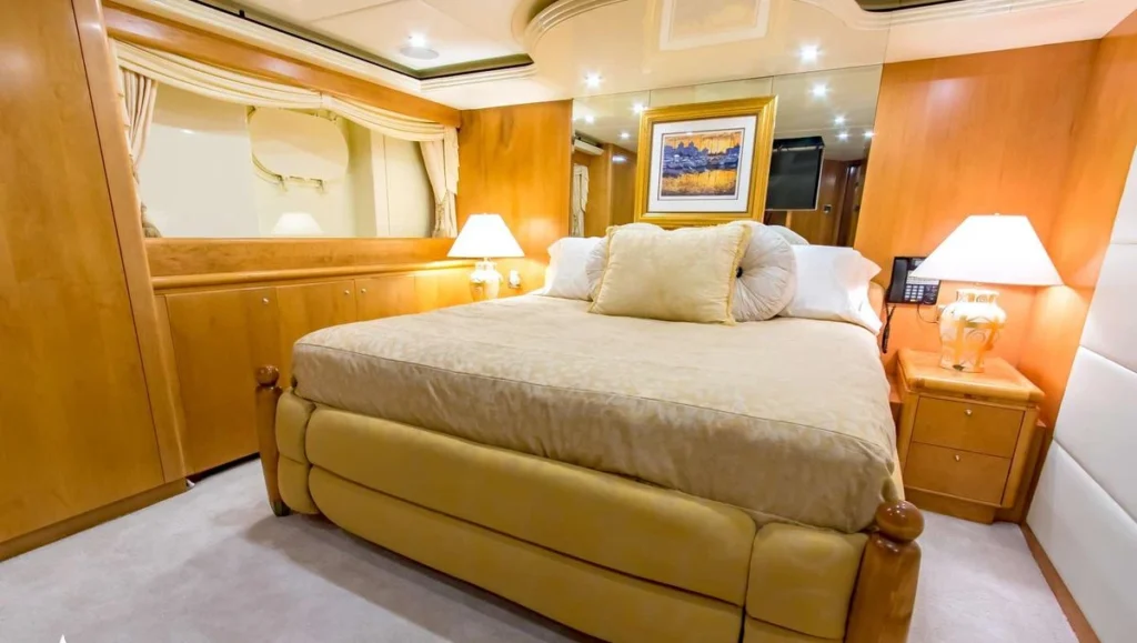 Guest cabin with king bed aboard charter yacht Cabernet