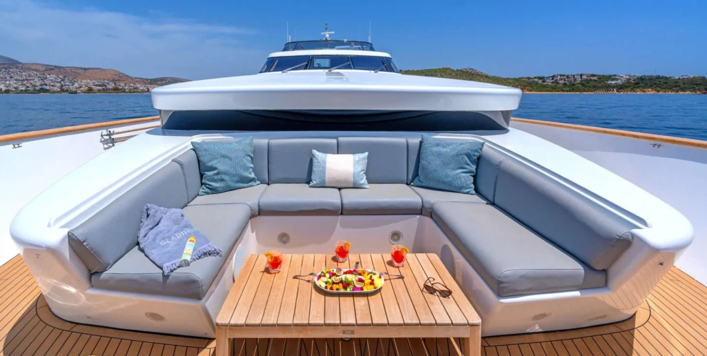 Sundeck seating and bar area aboard motor yacht Gladius overlooking the Greek coastline