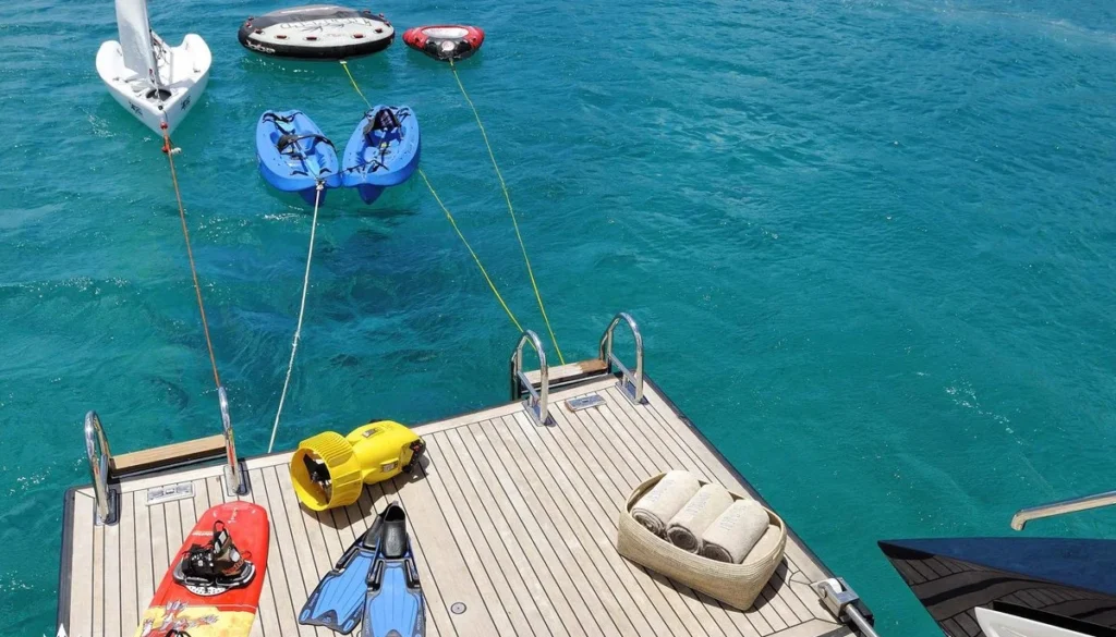 Drumbeat swim platform set up with water toys and sailing dinghy