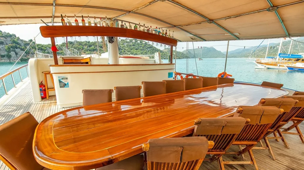 Shaded alfresco dining table aboard Grand Alaturka