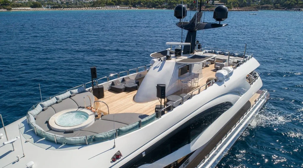 Hallo yacht sundeck with jacuzzi and lounge seating overlooking the coastline