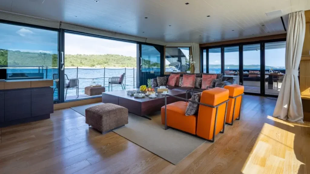 Main salon seating area aboard Journey yacht with sea view