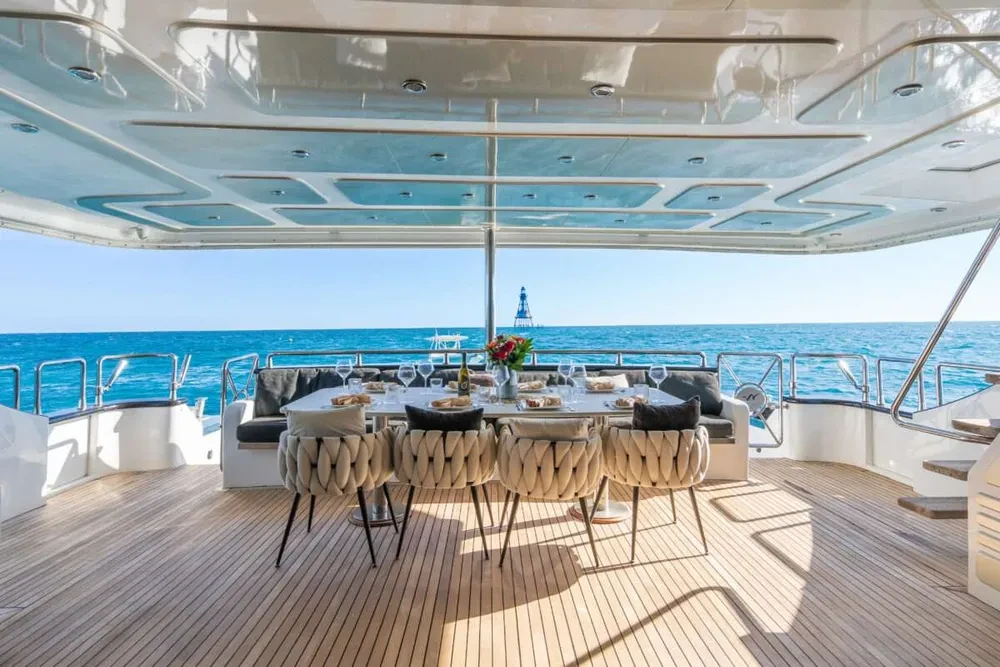 Aft deck dining area aboard Privilege yacht