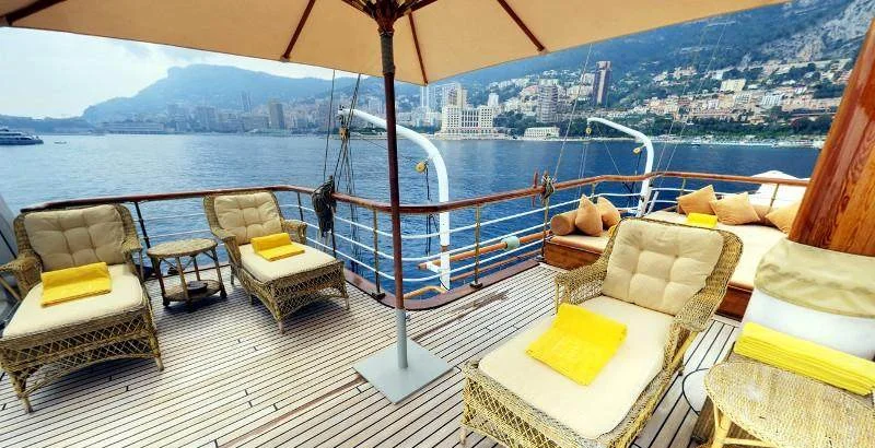 SS Delphine sun deck lounge with Monaco coastline backdrop