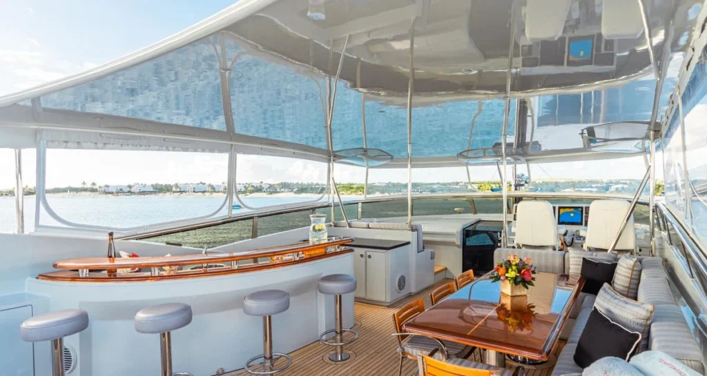 Temptation yacht outdoor flybridge bar and helm seating area