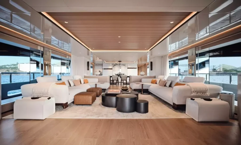 Xwave main salon interior with white sofas and dining area